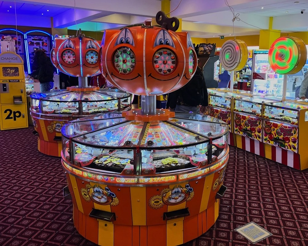 clockwork oranges ticket coin pusher
