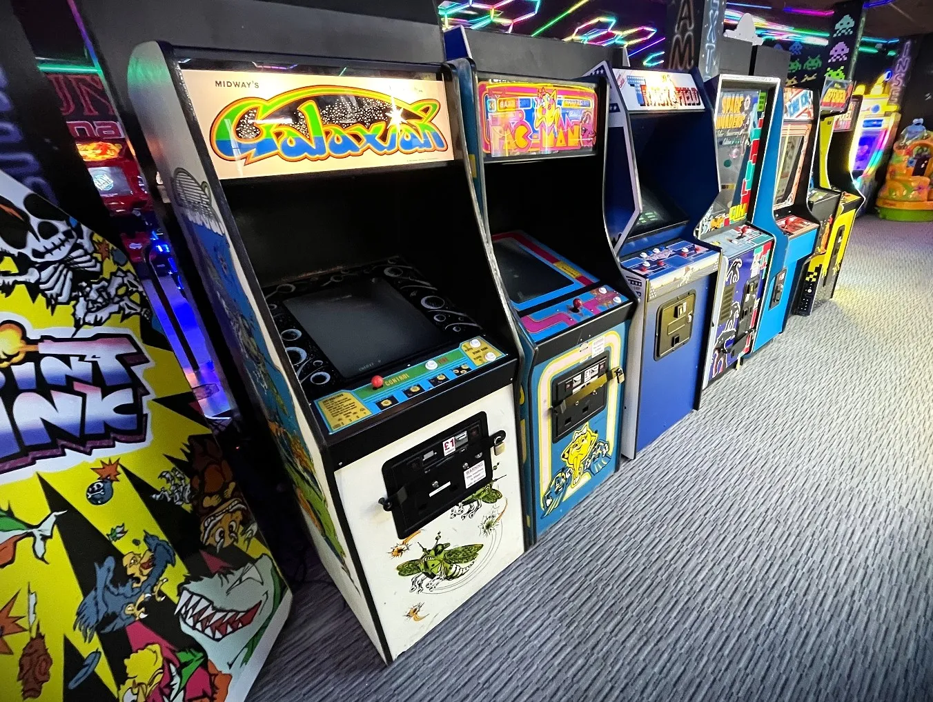 galaxian by midway in a row of retro video game cabinets