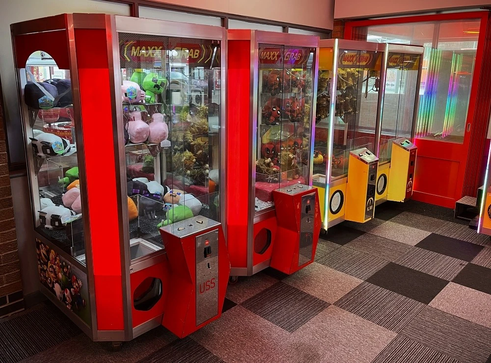 row of maxx grab claw machines
