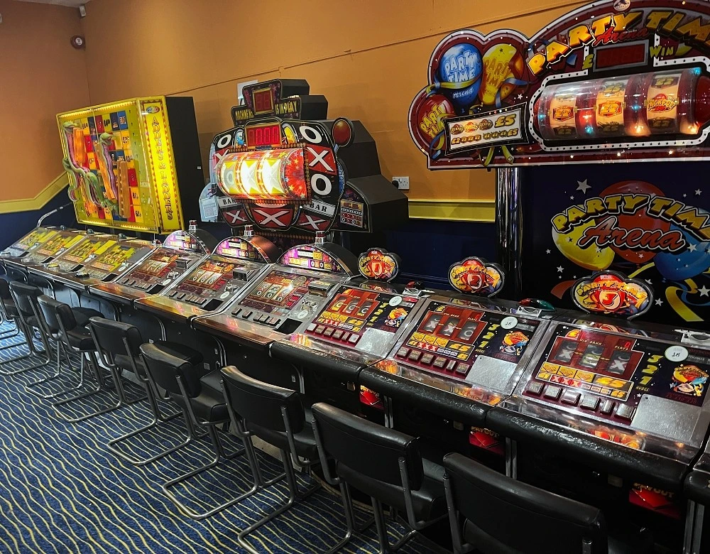 row of sit-down british fruit machines