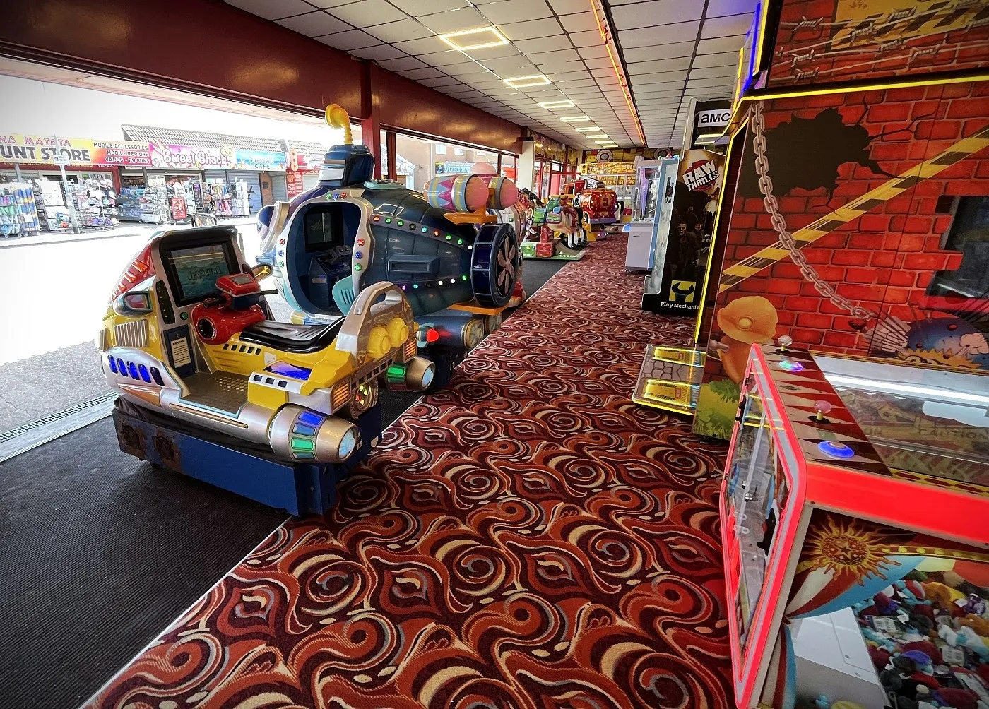 a row of kiddie rides