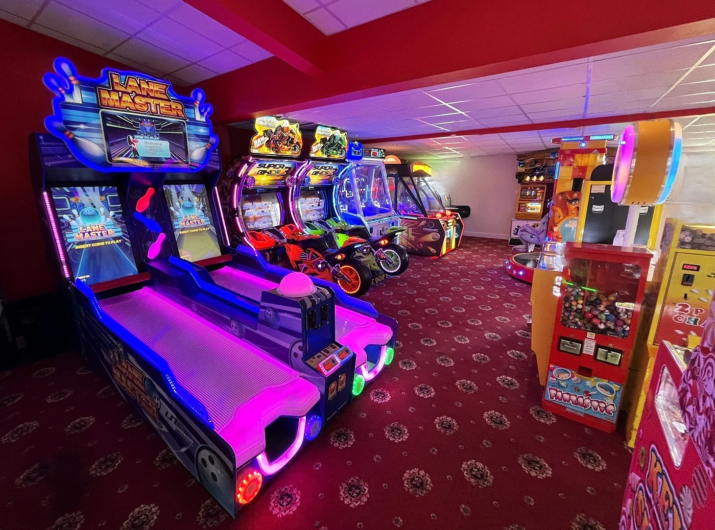 a row of fairground arcade games