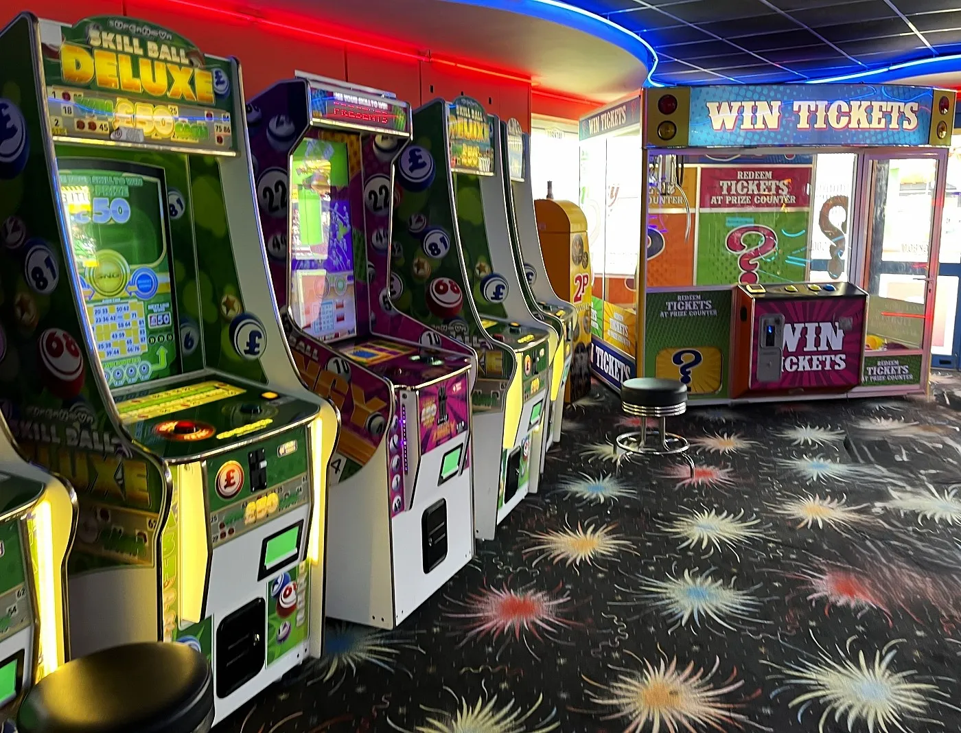 row of skill ball deluxe arcade machines