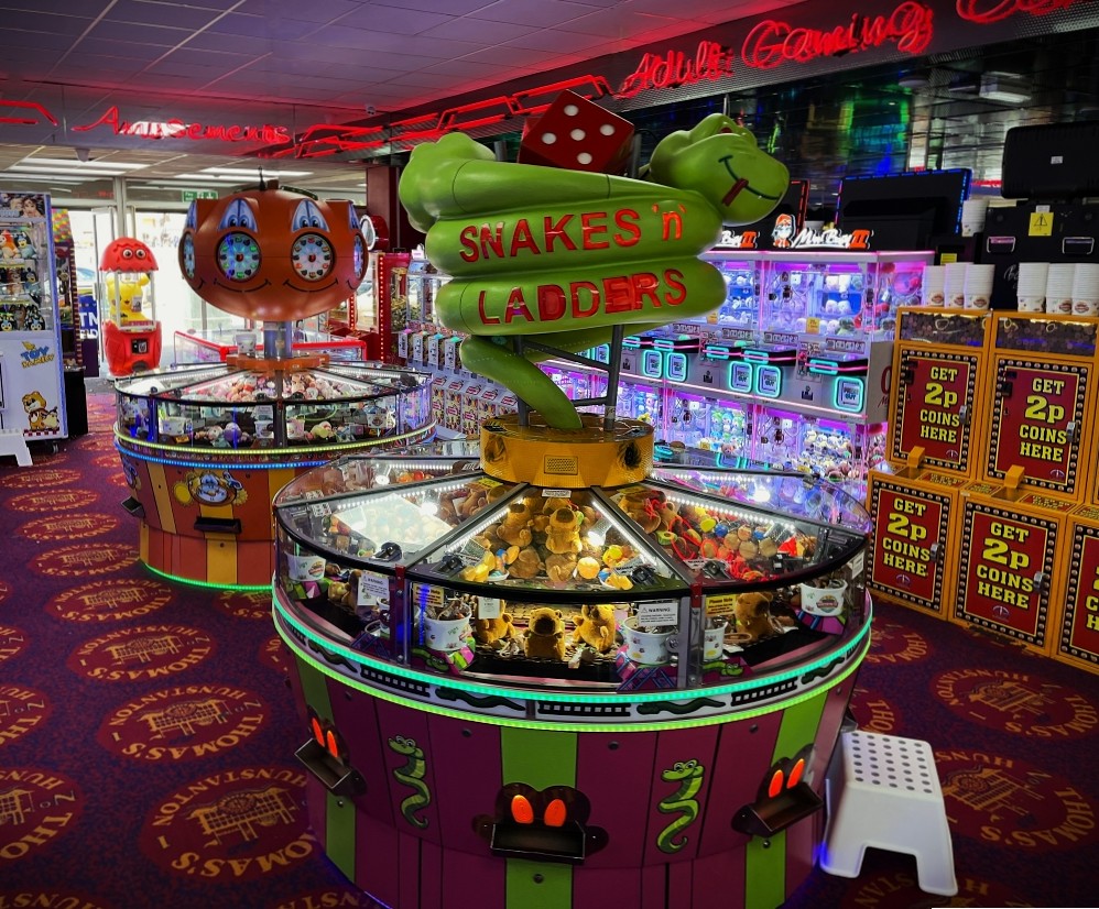 snakes n ladders circular coin pusher