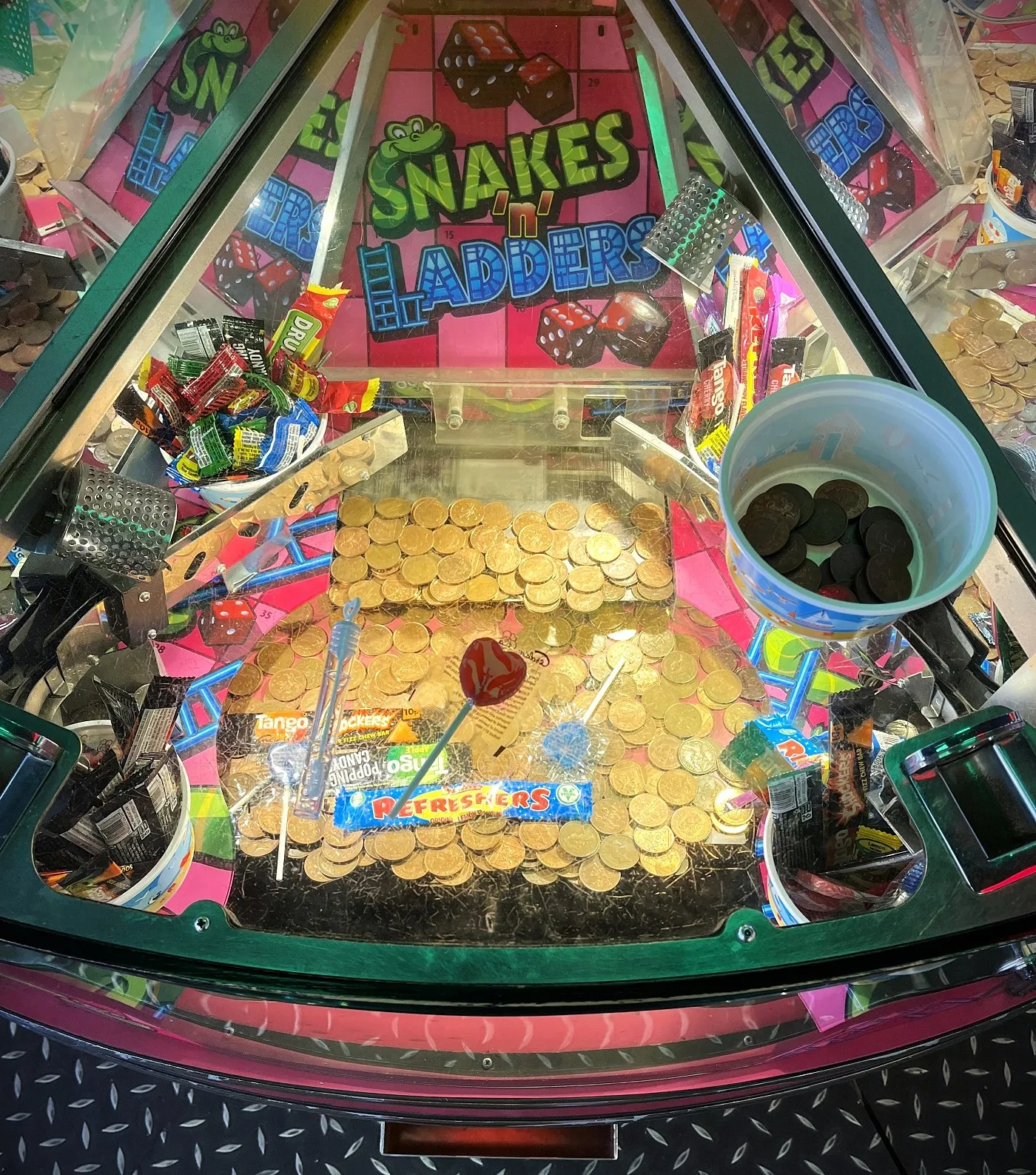 snakes and ladders coin pusher prize wins