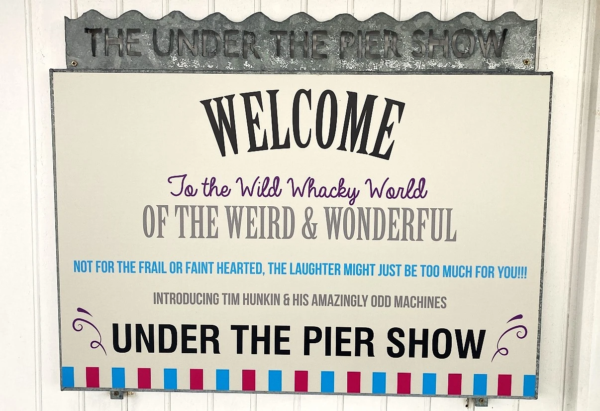 under the pier show sign