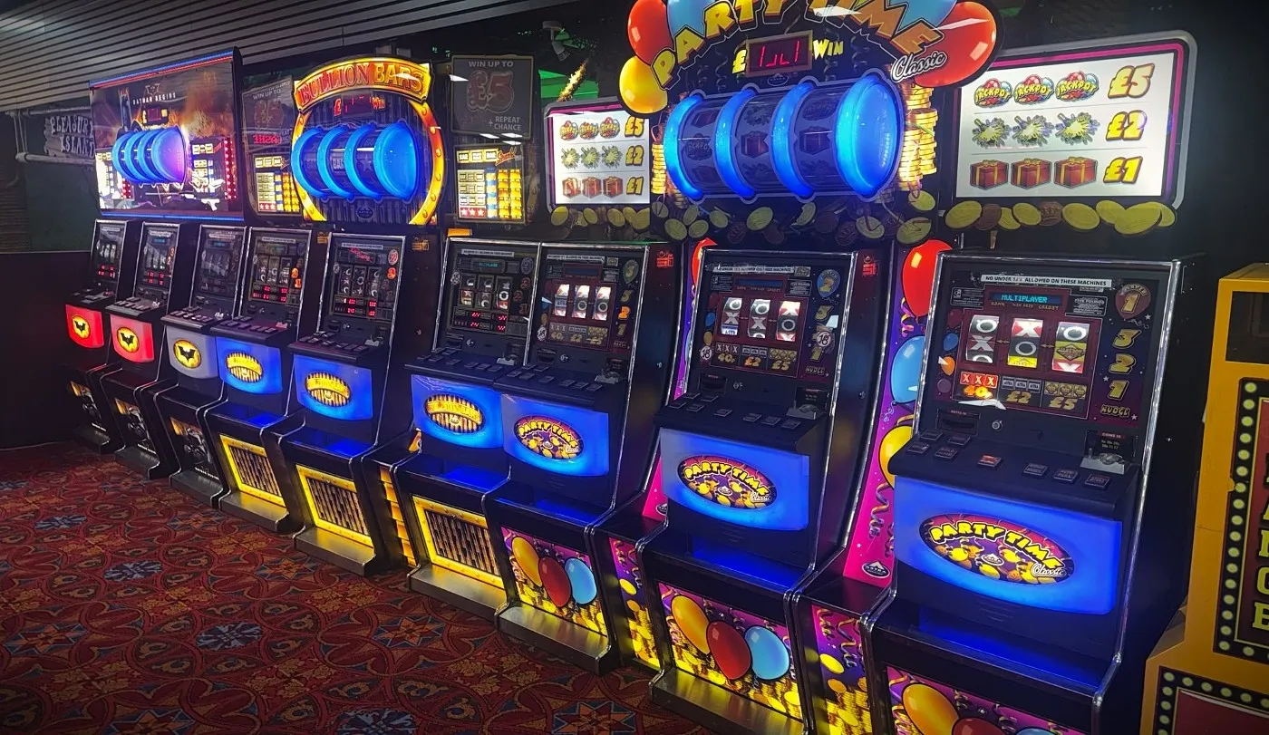 a row of triple row £5 jackpot fruit machines