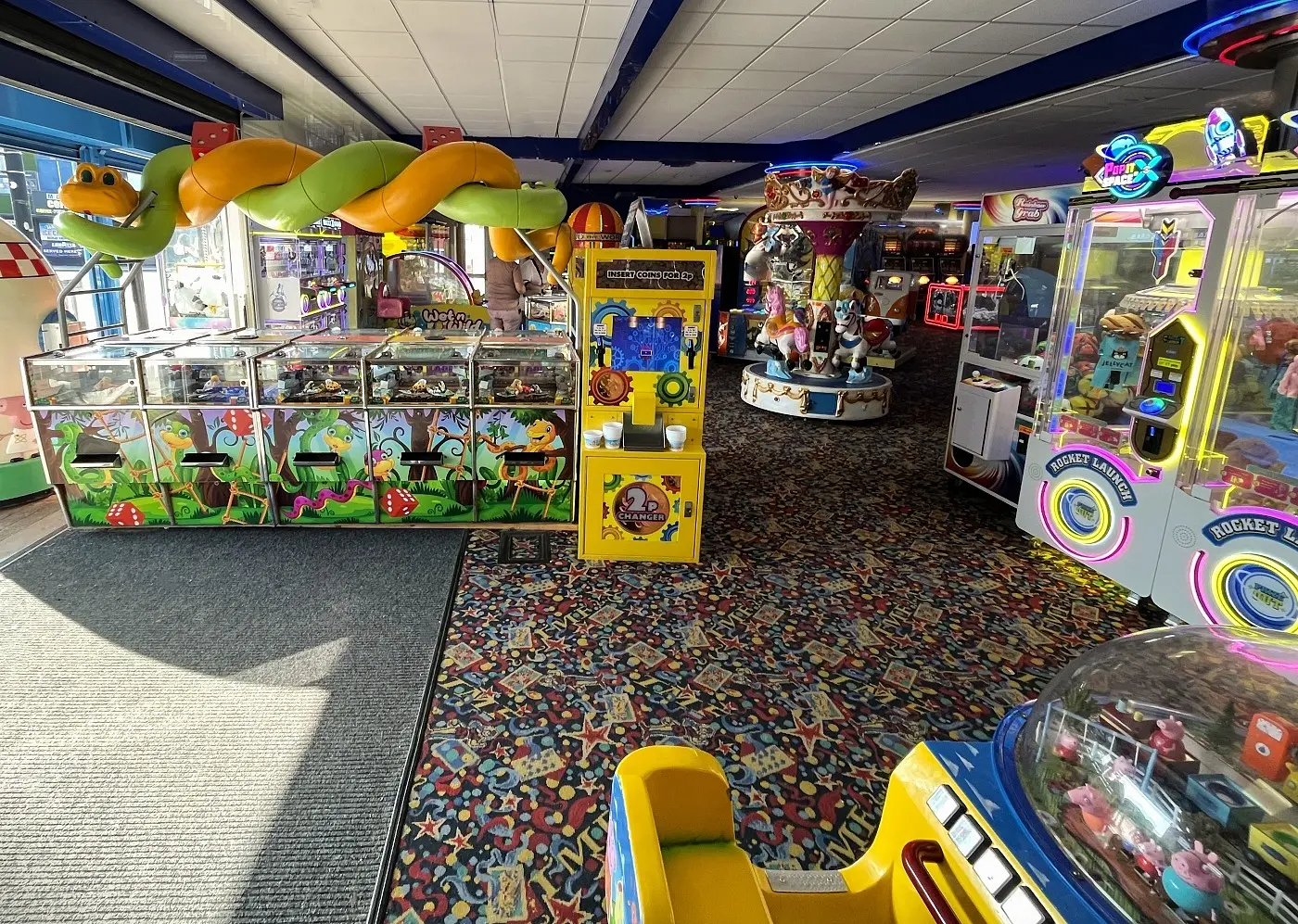snakes and ladders coin pushers at the mint arcade