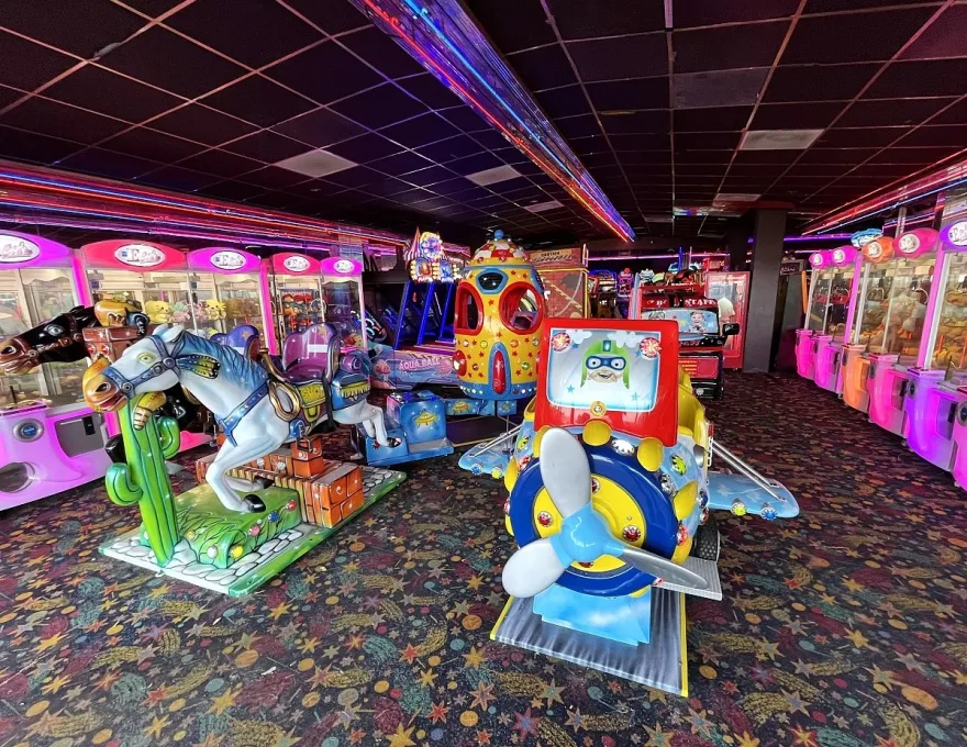 a collection of arcade kiddie rides