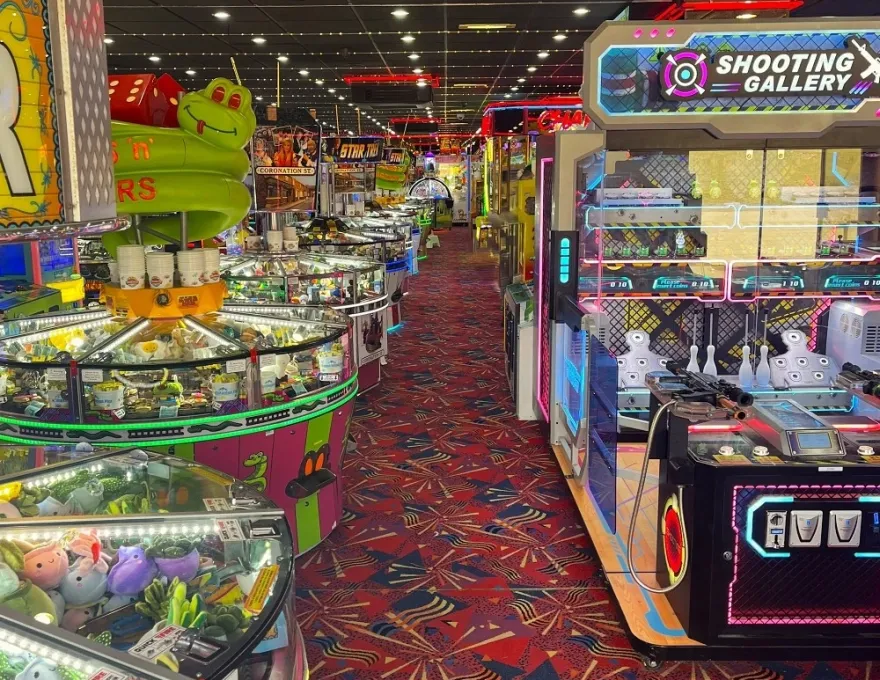 row of circular coin pushers